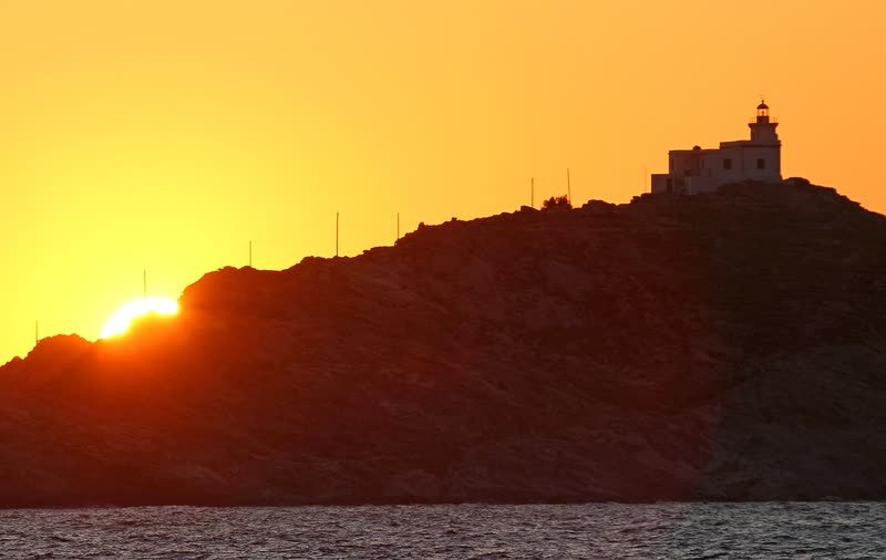 Sunset over a hilltop chapel on Paros